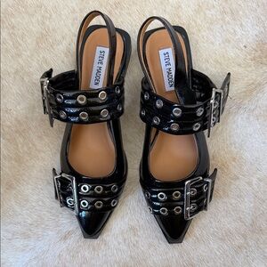 Steve Madden Graya slingback flats black patent silver buckles and a pointed toe